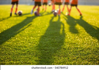 Blurred Soccer Field at School. Young Soccer Players Training on Pitch. Soccer Stadium Grass Background