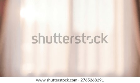 A blurred, soft focus image of sunlight filtering through sheer white curtains, creating a gentle and ethereal glow.