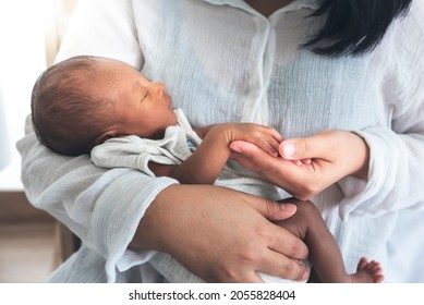 Blurred Soft Images Of African Black Skin, 12-day-old Baby Newborn Son, Sleeping With His Mother Being Held, To Family And African Black Skin Newborn Concept.