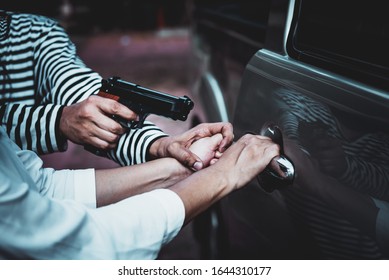 Blurred Soft Images Of Male Criminals Currently Using A Carbine To Rob Women Which Is About To Open The Pickup Truck Door, To Bandits And Weapons Concept.