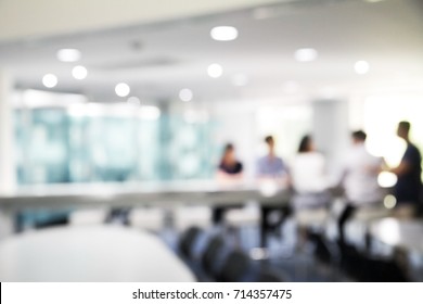 Blurred soft people meeting at table