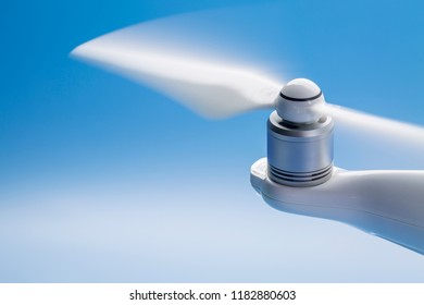 Blurred Spinning Propeller Of A Drone Against Blue Sky