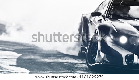 Blurred sport car drifting on speed track. Sport car wheel drifting and smoking with flare effect on track. Sport concept,drifting car concept.