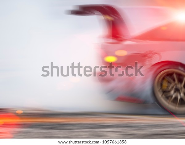 Blurred of Sport car wheel\
drifting and smoking on track.sport concept,drifting car\
concept