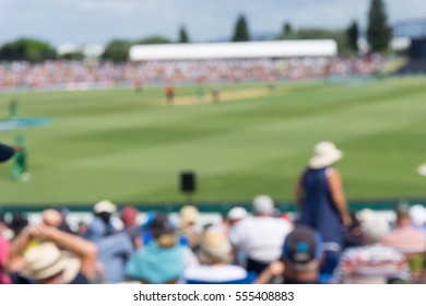 Blurred Sports Event Spectators At Cricket Match Background 