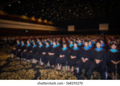 Blurred, Student Holding Valedictorian Speech At Graduation Ceremony.