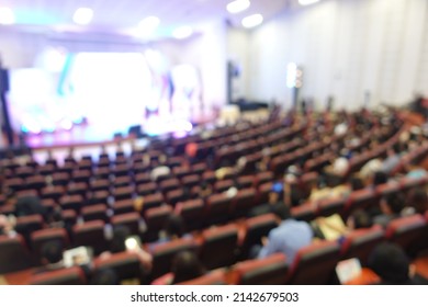 Blurred Of Students, Audience Keynote Speaker, People Meeting Start Up Business Program Collaboration Discussion And Listen In Convention Hall Background Concept. Event University Or Campus.