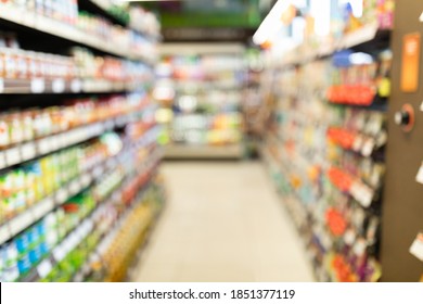 Blurred Supermarket Background, Grocery Store Aisle With Colorful Shelves And Food Products. Shopping Concept. Abstract Defocused Shot Of Groceries Shop Warehouse With No People