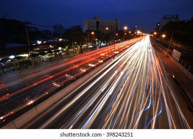 Blurred Tail Lights And Traffic Lights 