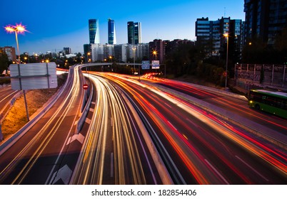 Blurred Tail Lights And Traffic Lights On Motorway