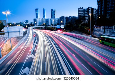 Blurred Tail Lights And Traffic Lights On Motorway