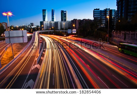 Blurred Tail Lights And Traffic Lights On Motorway