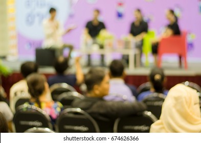 Blurred Talk Show On Stage With Guest Speakers, Host, Moderator And Audiences 