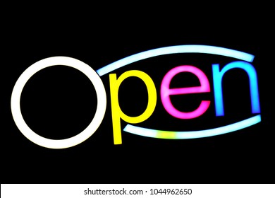 blurred text OPEN sign LED Bokeh light colorful on dark wall, Neon Light led letter Open on background black