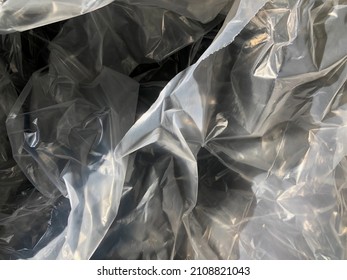 Blurred Texture Of Transparent Crumpled Plastic Sheet. Full Frame Of Wrinkle Plastic Wrap.