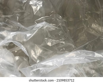 Blurred Texture Of Transparent Crumpled Plastic Sheet. Full Frame Of Wrinkle Plastic Wrap.