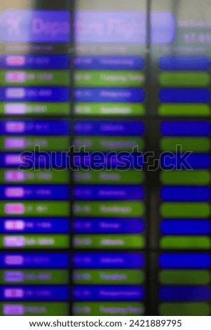Blurred timetable screen in train station. Airport Terminal: Arrival, Departure Information. Display Showing all the Useful Data For Travelers.