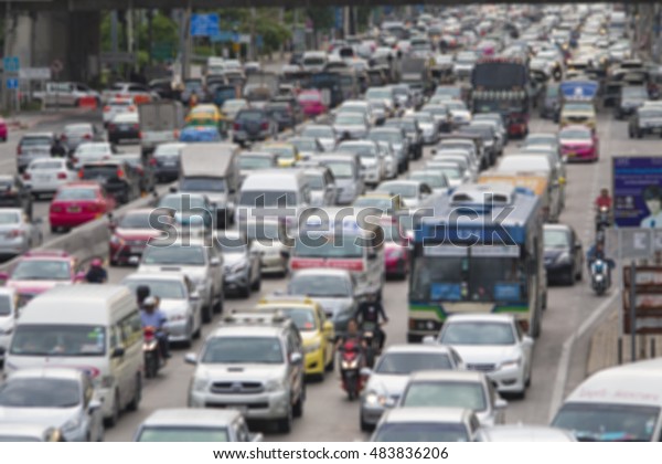 blurred traffic jam with sunlight on  street in\
bangkok , thailand