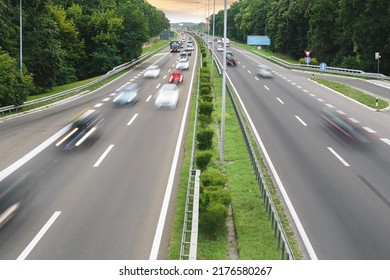 Blurred traffic on highway. High angle view of traffic on highway in sunset