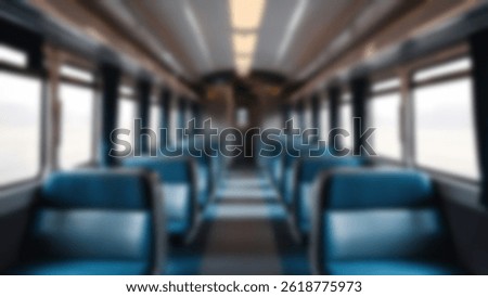 blurred train seats, interior inside a passenger train, economy class, with blurred train seats in the background