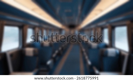 blurred train seats, interior inside a passenger train, economy class, with blurred train seats in the background