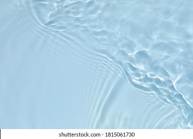 Blurred transparent blue colored clear calm water surface texture with splashes and bubbles. Trendy abstract nature background. Water waves in sunlight with copy space. - Shutterstock ID 1815061730