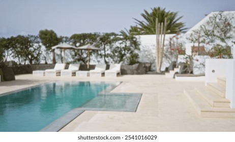 Blurred tropical resort with empty poolside chairs and lush greenery in the background, evoking a tranquil vacation ambiance