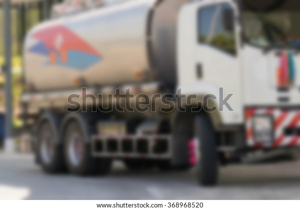 Blurred of  Truck with oil or gas tank for\
transport in Thailand