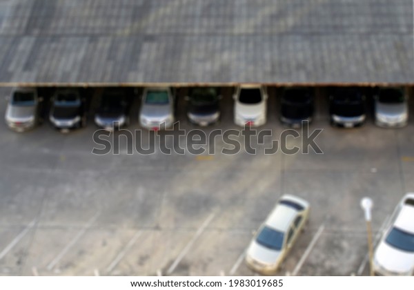 blurred\
urban cars at outdoor car park with top\
view