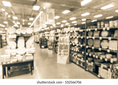 Blurred Variety Of Kitchen Utensils And Colorful Plates, Bowls And Cups Of Every Shape And Size Fill The Shelves Display At Store In Texas, US. Hand-held Tool, Gadget Necessities. Vintage Tone