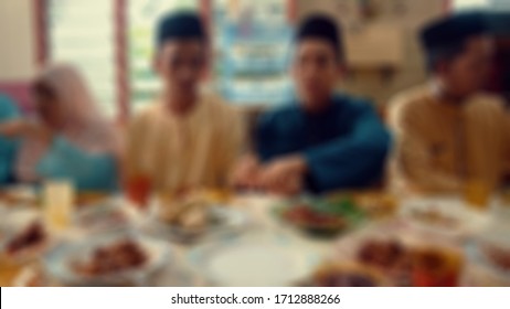 Blurred View Of Banquet Together During The Moment Of Eid Al-Fitr On South East Asian Big Family.