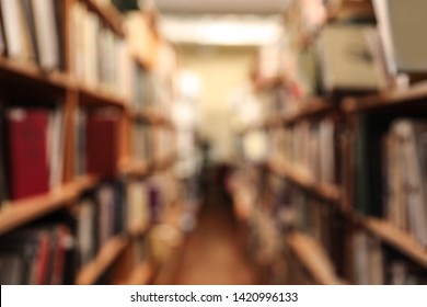 Blurred View Of Cabinets With Books In Library