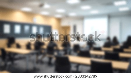 A blurred view of a classroom setting where students are seated at desks, attentively listening to a lecture or presentation.