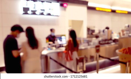 blurred view of customers queue to buying boba tea at boba tea shop inside convenience store in Bangkok ,Thailand. 