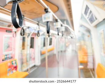 Blurred view of an empty subway train interior with bright yellow seats and stainless steel poles. The modern train car is well-lit, featuring overhead handles and smooth