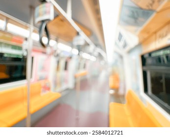 Blurred view of an empty subway train interior with bright yellow seats and stainless steel poles. The modern train car is well-lit, featuring overhead handles and smooth