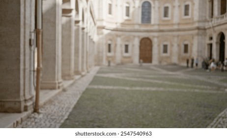 Blurred view of historic university campus courtyard with defocused architecture and students in background under a clear sky. - Powered by Shutterstock