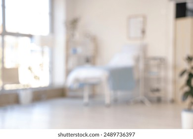 Blurred view of hospital ward with bed, drip infusion and shelf unit - Powered by Shutterstock