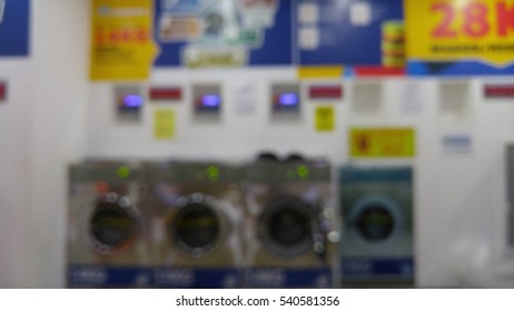 Blurred View Inside A Self Service Laundry Lounge. 