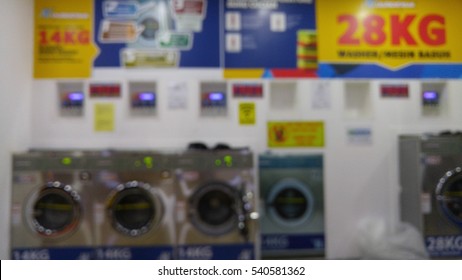 Blurred View Inside A Self Service Laundry Lounge. 