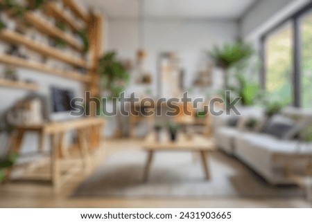 Blurred view of modern living room with sofa and soft bench. room interior with  couch, armchair and coffee table or shelving units. stylish living room. comfortable workplace near big window.