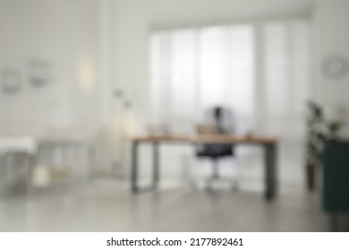 Blurred view of modern medical office with doctor's workplace. Interior design