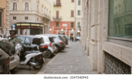 Blurred view of an old street in rome at night with defocused lights and parked cars capturing the essence of urban italy. - Powered by Shutterstock