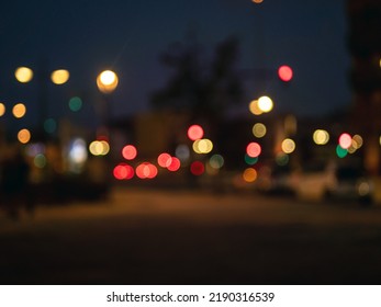 Blurred View On A Evening Crosstown Traffic With Traffic Lights. Defocused City Street View.