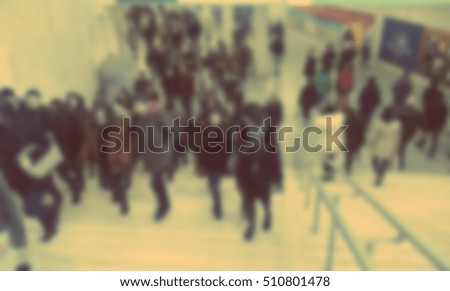 Blurred View of People in Metro with Retro Filter