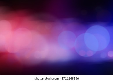 Blurred view of police cars on street at night - Shutterstock ID 1716249136