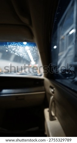 Blurred View through Car Windshield Driving through Tunnel without Rearview Mirror