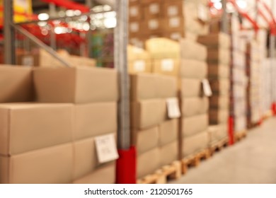 Blurred View Of Warehouse With Boxes. Wholesaling