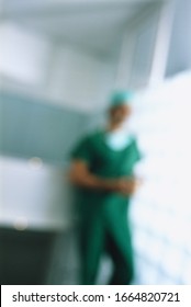 Blurred View Of A Young Male Surgeon Thinking In Office Setting
