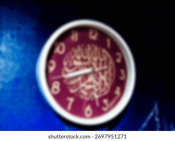 A blurred wall clock with a maroon face and golden numbers creates a soft, abstract look, giving the image a warm and artistic atmosphere